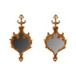 A PAIR OF LATE 19TH / EARLY 20TH CENTURY CARVED WOOD WALL MIRRORS in the Rococo style, each with