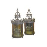 A VERY LARGE PAIR OF REGENCY STYLE BRONZE HALL LANTERNS of cylindrical form, the domed coronas