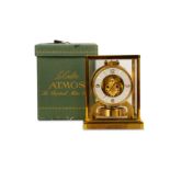 A 1950'S JAEGER LECOULTRE BRASS ATMOS CLOCK WITH ORIGINAL BOX AND PAPERS 'THE PERPETUAL MOTION