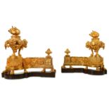 A PAIR OF LATE 19TH CENTURY FRENCH LOUIS XVI STYLE GILT BRONZE CHENETS the main supports cast as