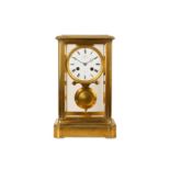 A THIRD QUARTER 19TH CENTURY FRENCH GILT BRONZE FOUR GLASS MANTEL CLOCK GIVEN BY NAPOLEON III, BY