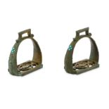 A PAIR OF TURQUOISE-ENCRUSTED BRONZE STIRRUPS