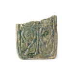 A FRAGMENTARY GREEN-GLAZED POTTERY TILE WITH BIRDS AND VEGETAL ARABESQUE