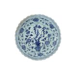 A MONUMENTAL BLUE AND WHITE POTTERY CHARGER