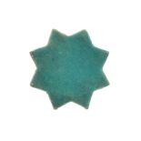 A TURQUOISE-PAINTED STAR POTTERY TILE PROPERTY OF THE LATE BRUNO CARUSO (1927 - 2018) COLLECTION