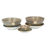 *A SET OF THREE PORCELAIN BOWLS AND DISHES WITH 'FAMILLE ROSE' DECORATION