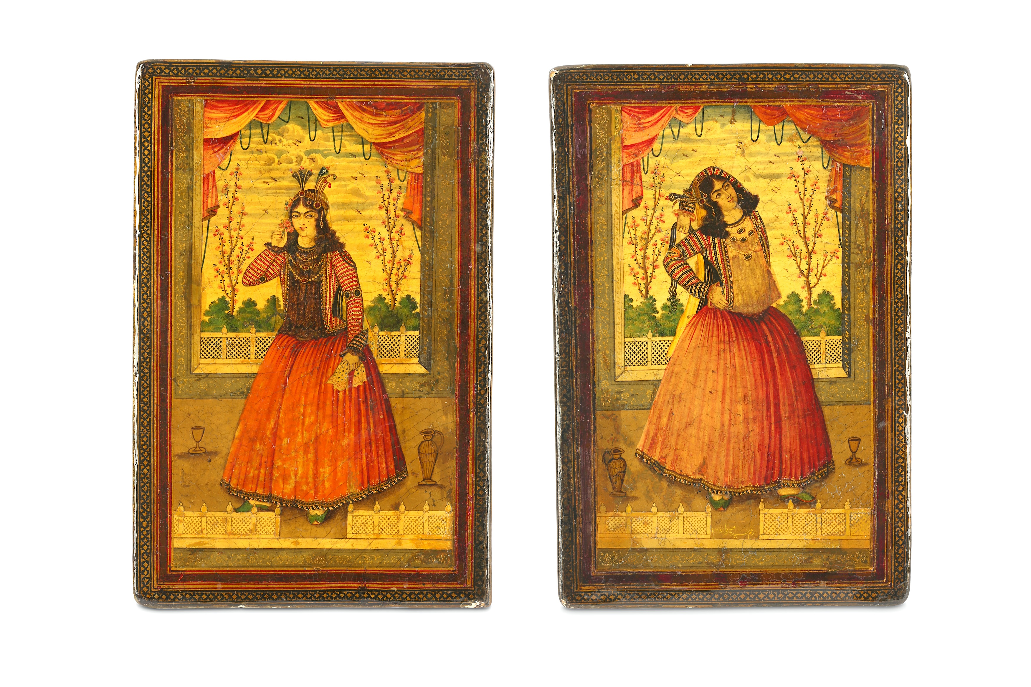 *A MATCHING PAIR OF QAJAR LACQUERED PAPIER-MÂCHÉ FIGURAL BOOKCOVERS