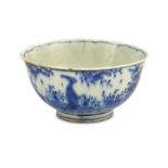 *A SMALL BLUE AND WHITE POTTERY RICE BOWL