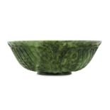 *A CHINESE SPINACH JADE BOWL WITH ARABIC CALLIGRAPHY