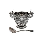 A Victorian sterling silver twin handled sugar bowl and sugar sifter, London 1892 by Wakely and