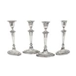 A set of four George V sterling silver candlesticks, Sheffield 1910 by James Deakin & Sons