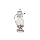 An Edwardian sterling silver mounted glass ecclesiastical claret jug, Sheffield 1904 by John Round