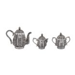 An early 20th century Anglo-Indian Raj unmarked silver three-piece tea set, Karachi circa 1911