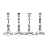 A set of four George III sterling silver candlesticks, London 1778 by John Scofield (reg. 13th Jan