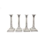 A set of four George V sterling silver candlesticks, Sheffield 1919-22 by Harrison Brothers &