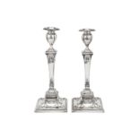A pair of Edwardian sterling silver candlesticks, London 1901 by Sibray, Hall & Co