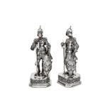 A pair of early 20th century German 935 standard silver and ivory figural ornaments, import marks