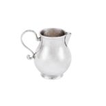 A George I silver ‘sparrow beak’ cream jug, London circa 1720, makers mark only for Seth Lofthouse