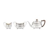 A George III sterling silver three-piece tea service, London 1807, the teapot by Thomas Wallis