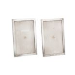 A pair of Victorian sterling silver mounted photograph frames, London 1899 by James Samuel Bell &
