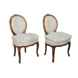 A set of twelve French Louis XV style beech dining chairs