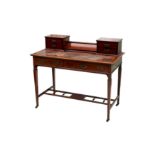 An Edwardian mahogany and line inlaid desk