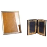 A rectangular silver photograph frame and another