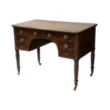 † A George III mahogany kneehole desk