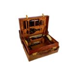 † A Hill and Millard crocodile skin travelling vanity case