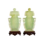 A pair of Chinese serpentine vases and covers.