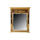 An Italian reproduction Empire style parcel gilt and hardwood overmantel mirror