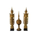 A pair of late 20th Century carved gilt wood Thai Buddhist figures