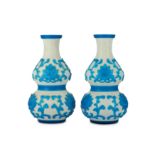 A pair of Chinese Peking glass turquoise overlay white 'double gourd' vases.