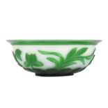 A Chinese Peking glass green overlay white 'lotus' bowl.