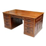 A circa 1900 walnut pedestal desk