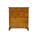 A George II figured walnut chest on chest