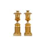 WITHDRAWN - A pair of second quarter 19th century French gilt and silvered bronze candlesticks
