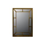 A Regency and later rectangular gilt mirror with a sectional mirrored frame