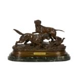 A late 19th/early 20th century French patinated bronze group of dogs,