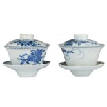 Two Chinese blue and white tea bowls, covers and stands.