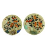 A pair of Chinese hardstone-inlaid pale celadon jade circular panels.