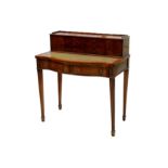 A mid to late 20th Century George III style bow fronted mahogany writing table