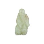 A Chinese pale celadon jade carving of shoulao.