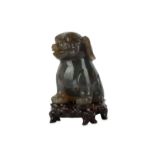A Chinese agate carving of a lion dog.