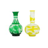 Two Chinese Peking glass overlay white bottle vases.