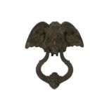 A 19TH CENTURY CAST IRON DOOR KNOCKER MODELLED WITH A DEVIL