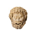 AN 18TH CENTURY ITALIAN CARVED MARBLE FOUNTAIN HEAD DEPICTING A BEARDED SATYR