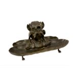 A 19TH CENTURY BRONZE INKWELL FORMED AS A GROTESQUE BEAST
