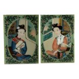 A PAIR OF CHINESE REVERSE GLASS PAINTINGS OF LADIES.