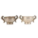 A PAIR OF CHINESE SILVER TEA CUPS.